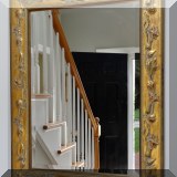D18. Gold beveled edge mirror with floral relief edge. 34”h x 26”w - $250